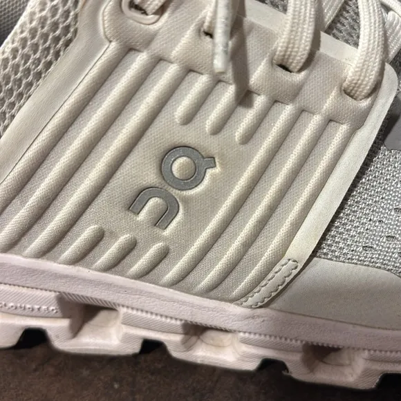 On cloud, white walking shoes