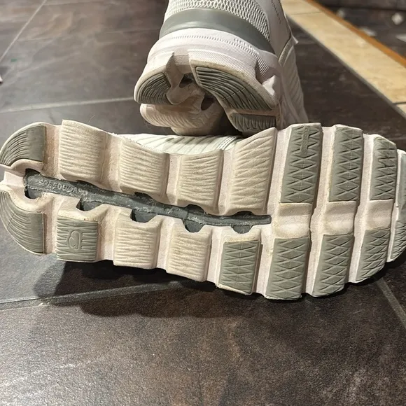 On cloud, white walking shoes