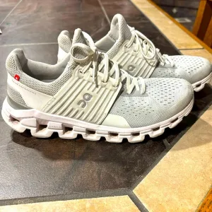 On cloud, white walking shoes